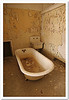 rusty old bathtub in a condemned building