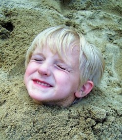 Kid head in the sand