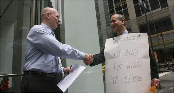 Joshua Persky wearing his sandwich board ad